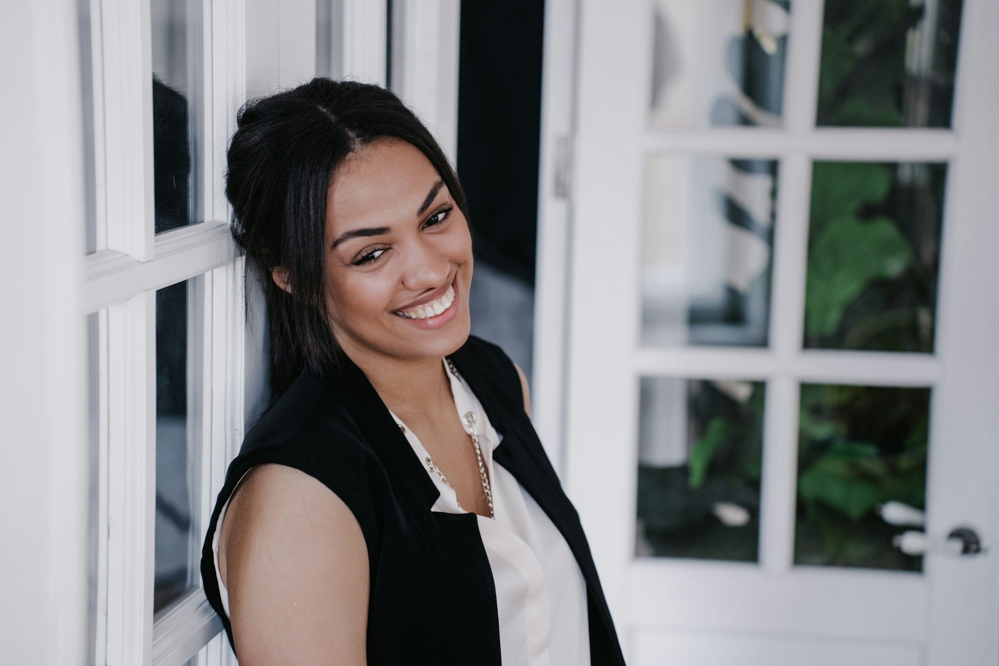 Close up portrait of African American woman at home look aside with adorable smile.
